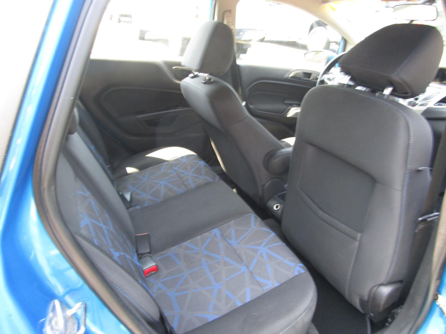 2013 Blue /Black / Cloth Ford Fiesta SE Hatchback (3FADP4EJ8DM) with an 1.6L L4 DOHC 16V engine, 5 SPEED AUTOMATIC transmission, located at 1814 Albert Pike Road, Hot Springs, AR, 71913, (501) 623-1717, 34.494228, -93.094070 - Photo#8