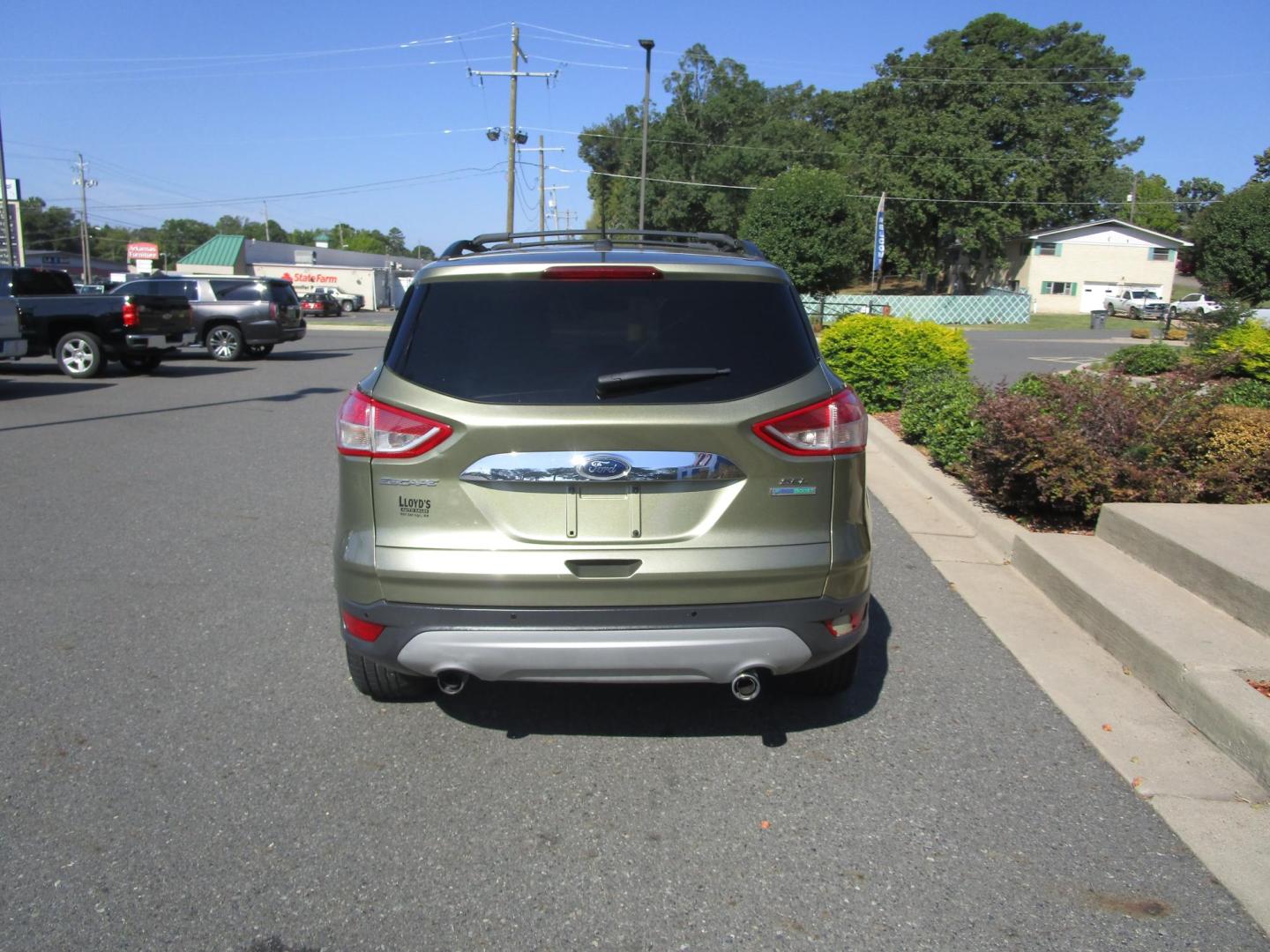 2013 Green /Black / Leather Ford Escape SEL FWD (1FMCU0HX4DU) with an 1.6L L4 DOHC 16V engine, 6-Speed Automatic transmission, located at 1814 Albert Pike Road, Hot Springs, AR, 71913, (501) 623-1717, 34.494228, -93.094070 - Photo#5