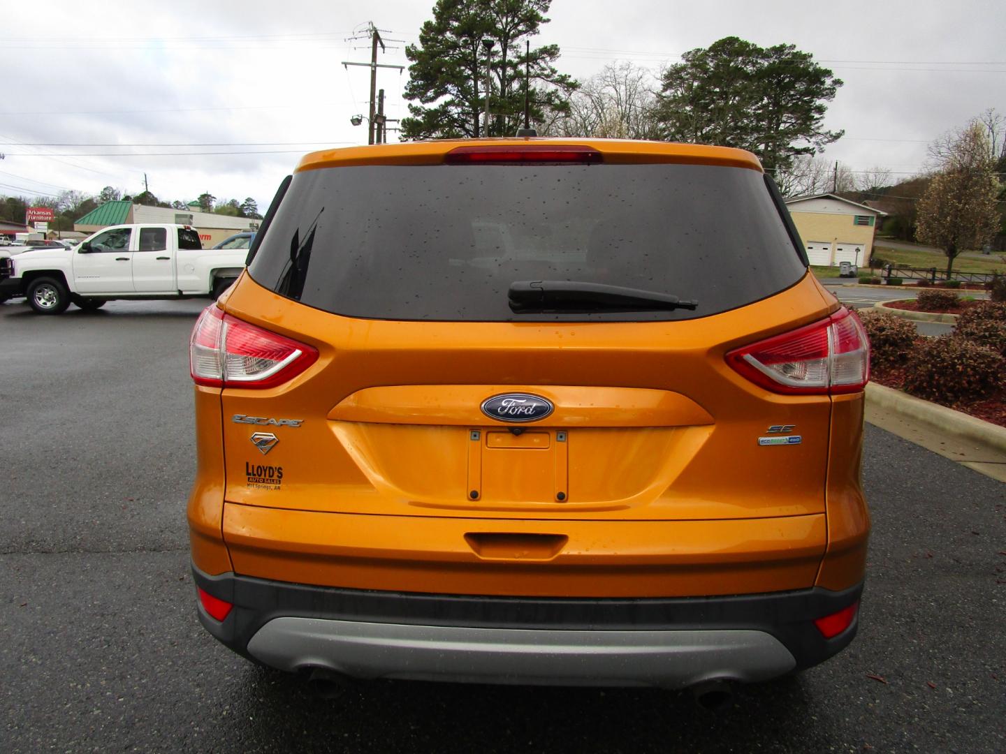 2016 Orange /Tan / Cloth Ford Escape SE 4WD (1FMCU9GX0GU) with an 1.6L L4 DOHC 16V engine, 6-Speed Automatic transmission, located at 1814 Albert Pike Road, Hot Springs, AR, 71913, (501) 623-1717, 34.494228, -93.094070 - Photo#4