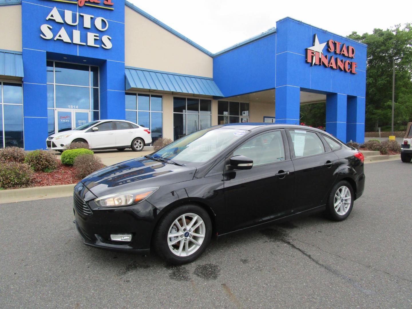 2016 BLACK /Gray / Cloth Ford Focus SE Sedan (1FADP3F22GL) with an 2.0L L4 DOHC 16V engine, located at 1814 Albert Pike Road, Hot Springs, AR, 71913, (501) 623-1717, 34.494228, -93.094070 - Photo#1