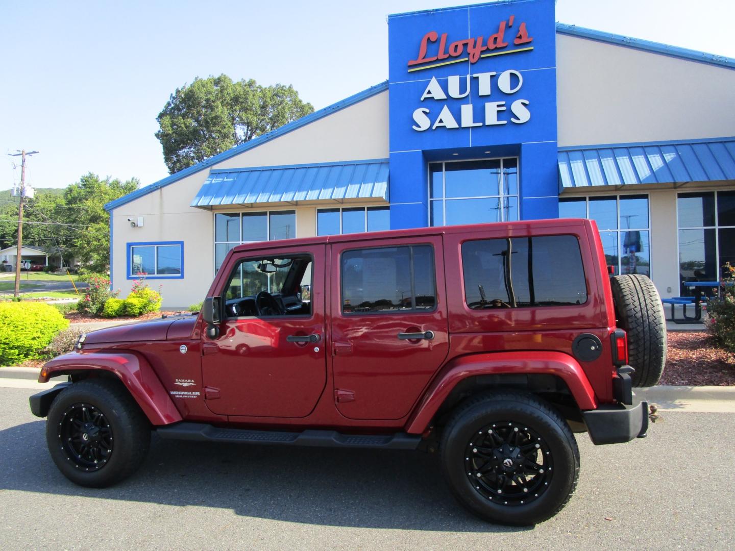 2013 MAROON Jeep Wrangler Unlimited Sahara 4WD (1C4BJWEG9DL) with an 3.6L V6 DOHC 24V FFV engine, located at 1814 Albert Pike Road, Hot Springs, AR, 71913, (501) 623-1717, 34.494228, -93.094070 - Photo#0