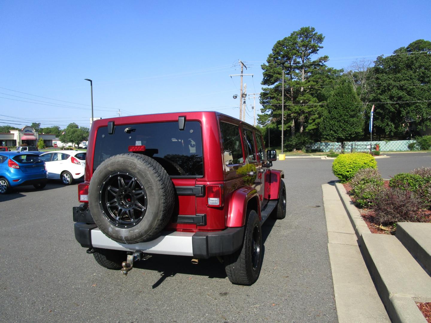 2013 MAROON Jeep Wrangler Unlimited Sahara 4WD (1C4BJWEG9DL) with an 3.6L V6 DOHC 24V FFV engine, located at 1814 Albert Pike Road, Hot Springs, AR, 71913, (501) 623-1717, 34.494228, -93.094070 - Photo#3