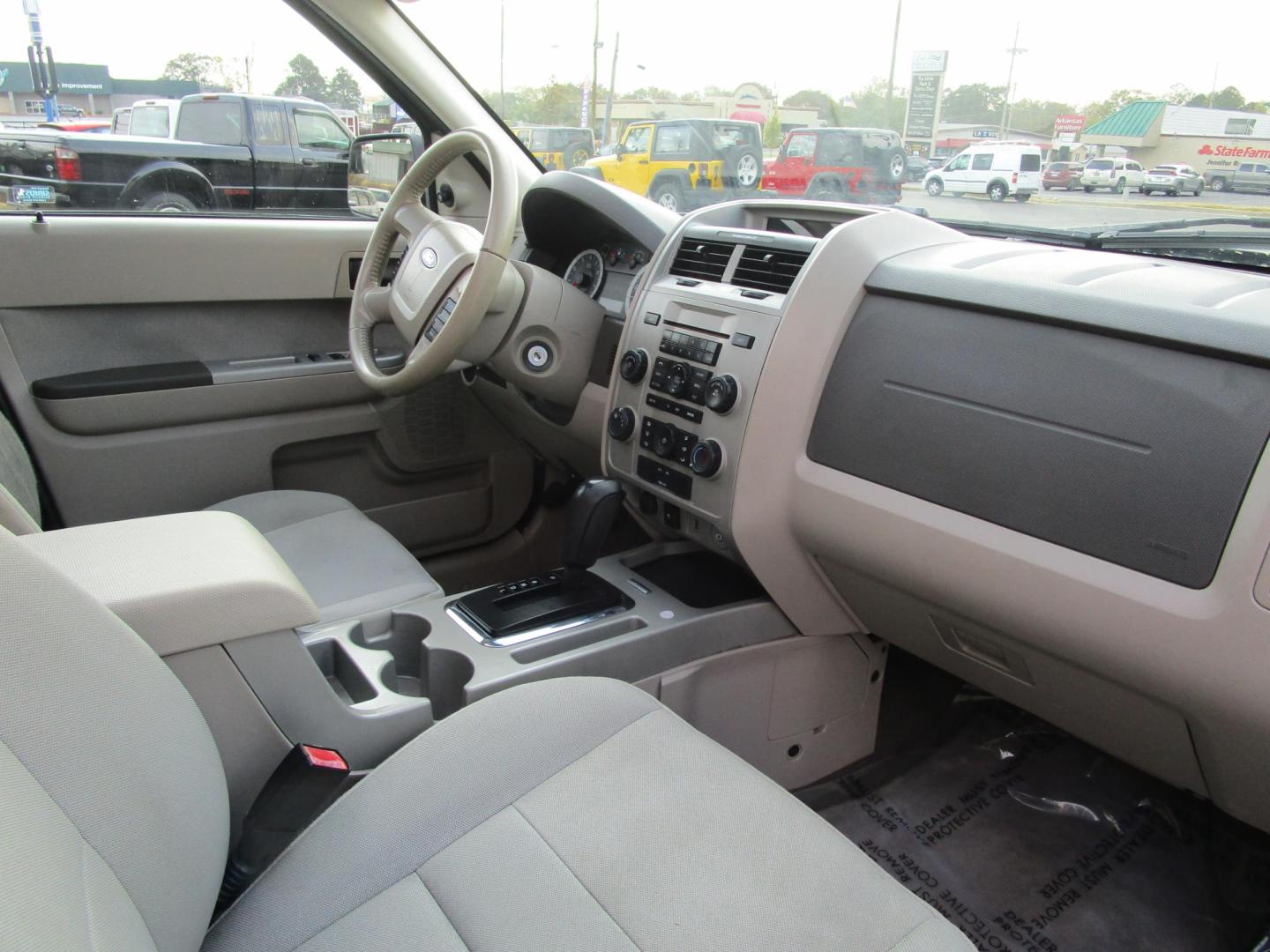 2010 Grey /Gray / Cloth Ford Escape XLT 4WD (1FMCU9D71AK) with an 2.5L L4 DOHC 16V engine, 6-Speed Automatic transmission, located at 1814 Albert Pike Road, Hot Springs, AR, 71913, (501) 623-1717, 34.494228, -93.094070 - This 2010 Ford Escape XLT, has low miles and gets great gas mileage. 103" wheelbase, 6 speed automatic transmission. Exterior Features Include: Chrome grille. Easy fuel capless filler. Fog lamps. Manual fold power windows. Blind spot mirrors. Roof rack with side rails. Interior Features Incl - Photo#5