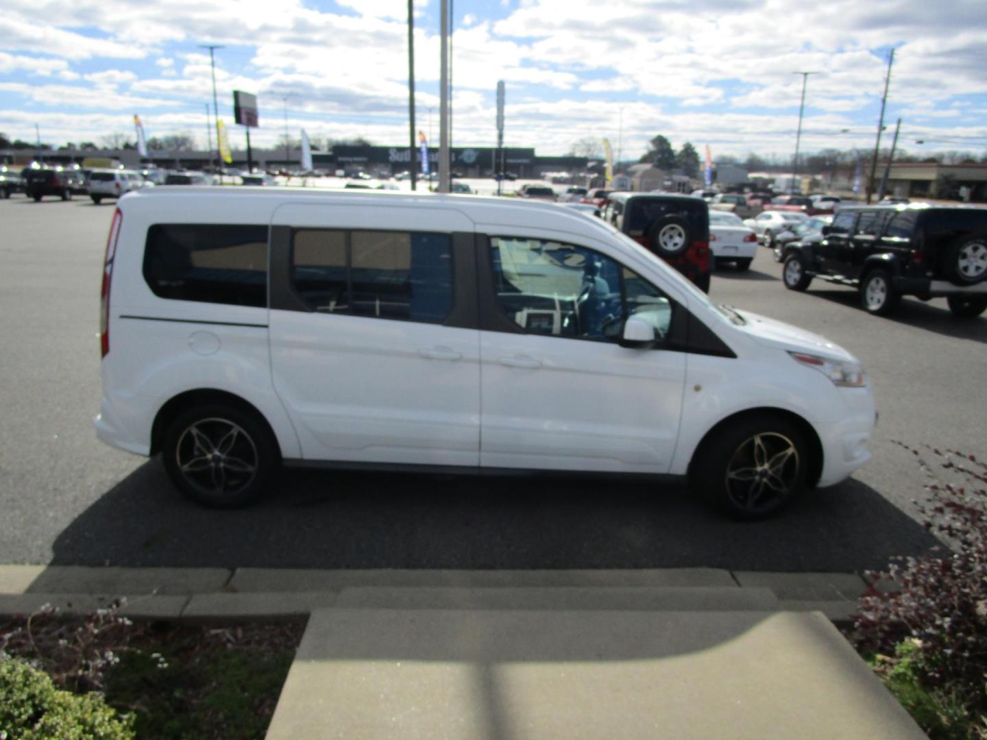 2017 WHITE /Stone Ford Transit Connect Wagon Titanium w/Rear Liftgate LWB (NM0GE9G71H1) with an 2.5L L4 DOHC 16V engine, 6A transmission, located at 1814 Albert Pike Road, Hot Springs, AR, 71913, (501) 623-1717, 34.494228, -93.094070 - 2017 Ford Transit Connect Titanium 7 Passenger 2.5L DOHC Engine 6 Speed Automatic Transaxle W O/D. Exterior Features: Auto Halogen Headlamps. Dual Sliding Side Doors. Liftgate with Fixed Glass. Fog Lamps. Integrated Spotter Mirrors. Power Adjust/Heated/Fold Exterior Mirrors. Rain Sensing Wipers - Photo#2