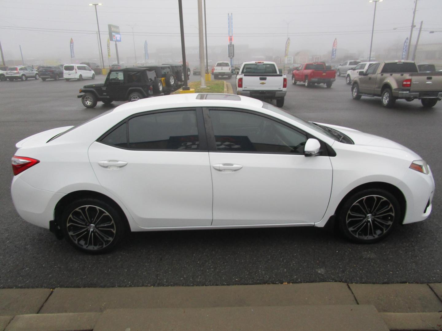 2015 WHITE /BLACK Toyota Corolla L 4-Speed AT (5YFBURHE3FP) with an 1.8L L4 DOHC 16V engine, 4-Speed Automatic transmission, located at 1814 Albert Pike Road, Hot Springs, AR, 71913, (501) 623-1717, 34.494228, -93.094070 - Photo#2